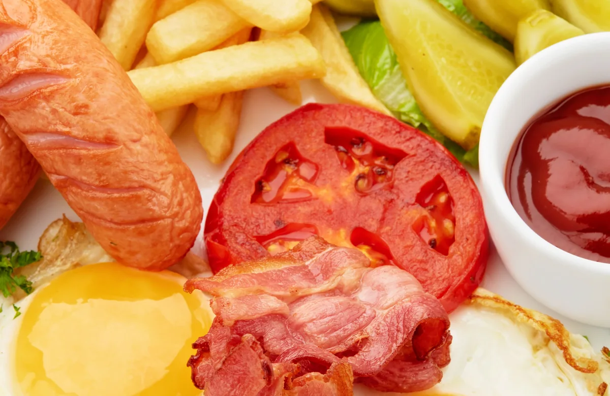 Freshly cooked breakfast with eggs, bacon and chips, used as the preview for the café website template